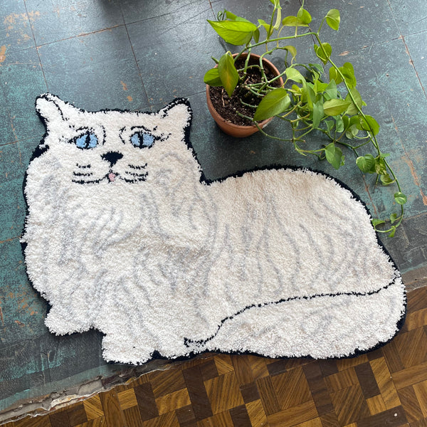 Persian cat rug by a shop of things available at hey tiger Louisville 