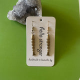 Brass articulated fish earrings by hello stranger 