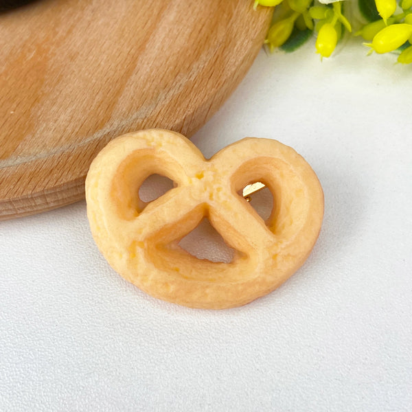 Pretzel cookie hair clip available at hey tiger Louisville 