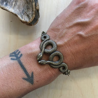 Slithering snake stacking bracelet cuff by Hello Stranger // handmade in the USA // unique statement piece // vintage style oxidized brass /