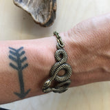 Slithering snake stacking bracelet cuff by Hello Stranger // handmade in the USA // unique statement piece // vintage style oxidized brass /